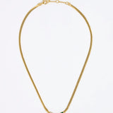 Gold necklace with a green and white fan shaped pendant on a white background