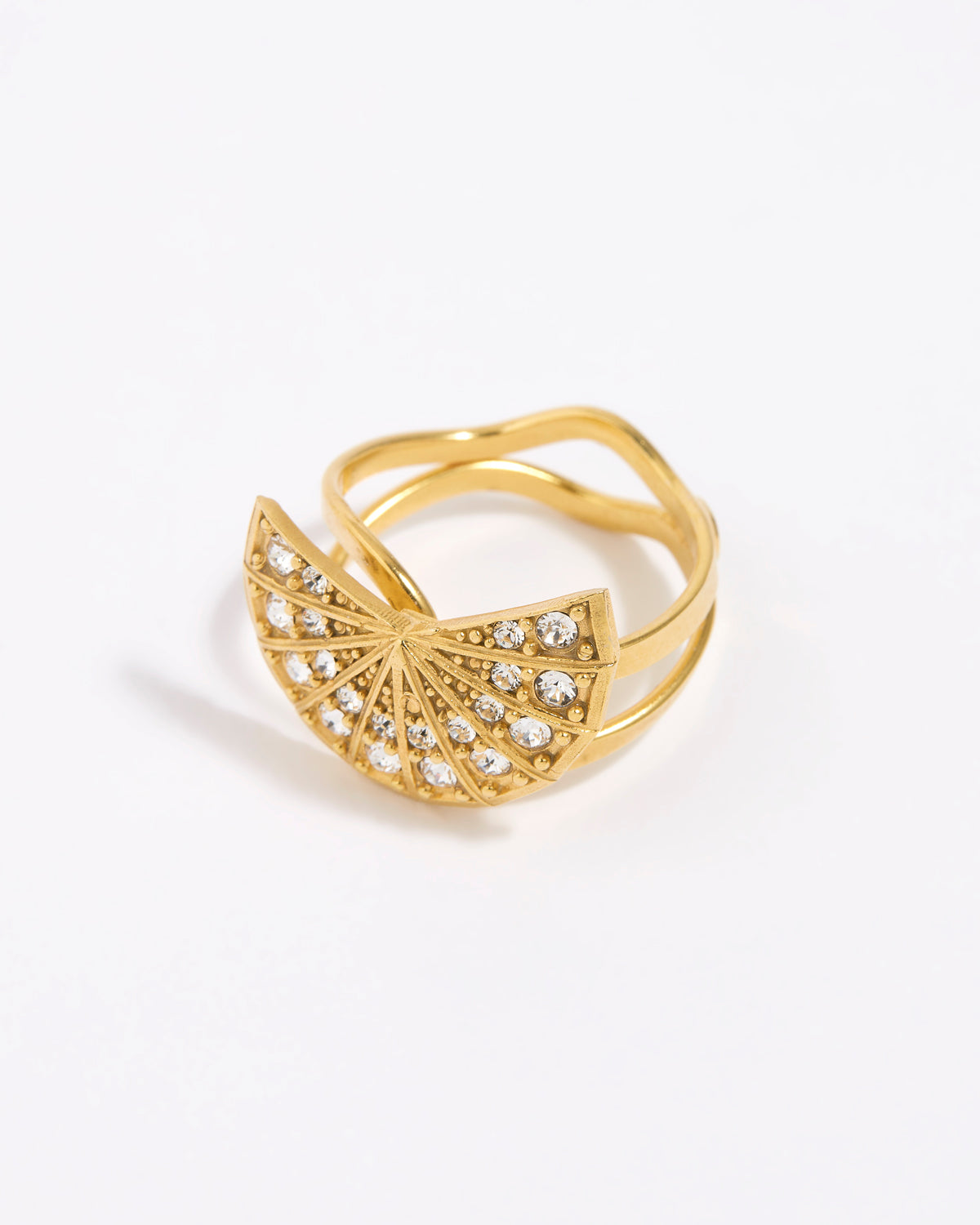 Gold ring with fan design and embedded stones on a white background