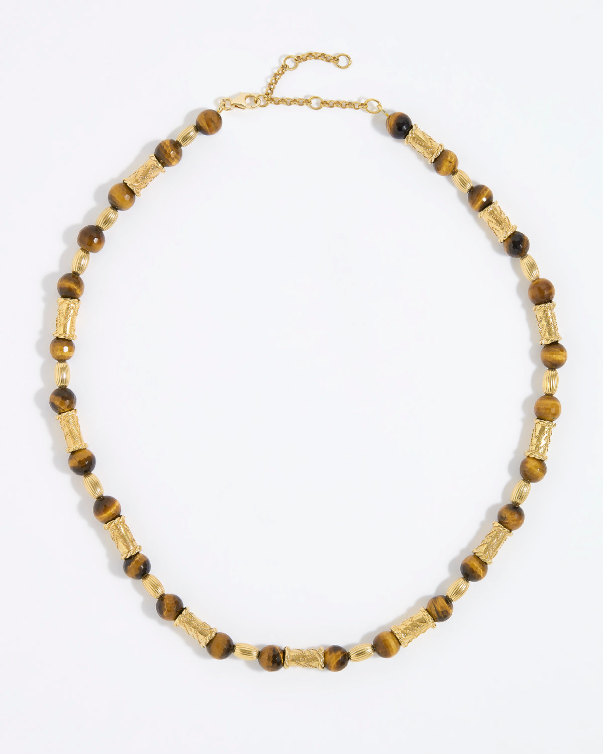 Beaded necklace with gold and tigers eye beads on white background