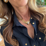 pearl and gold earrings and necklae being worn- close up shot 