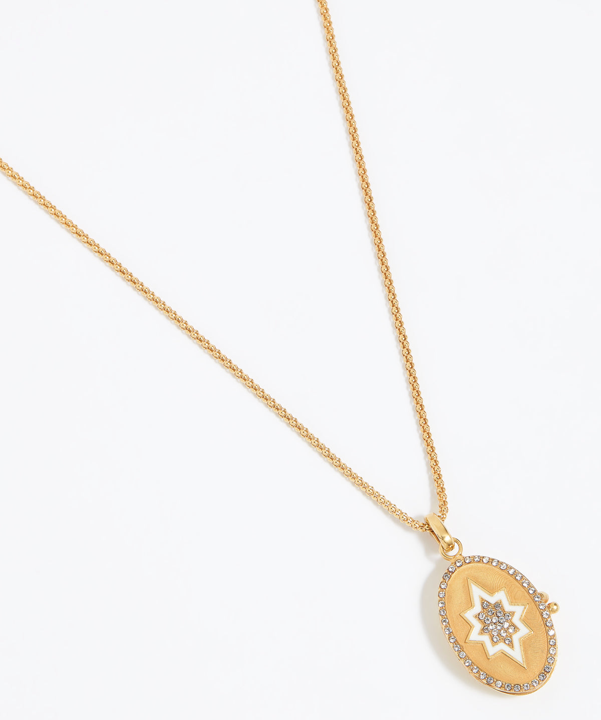 Oval Gold pendant with white start and crystals to centre of star and around the edge attached to a gold rope chain and shown on a white background