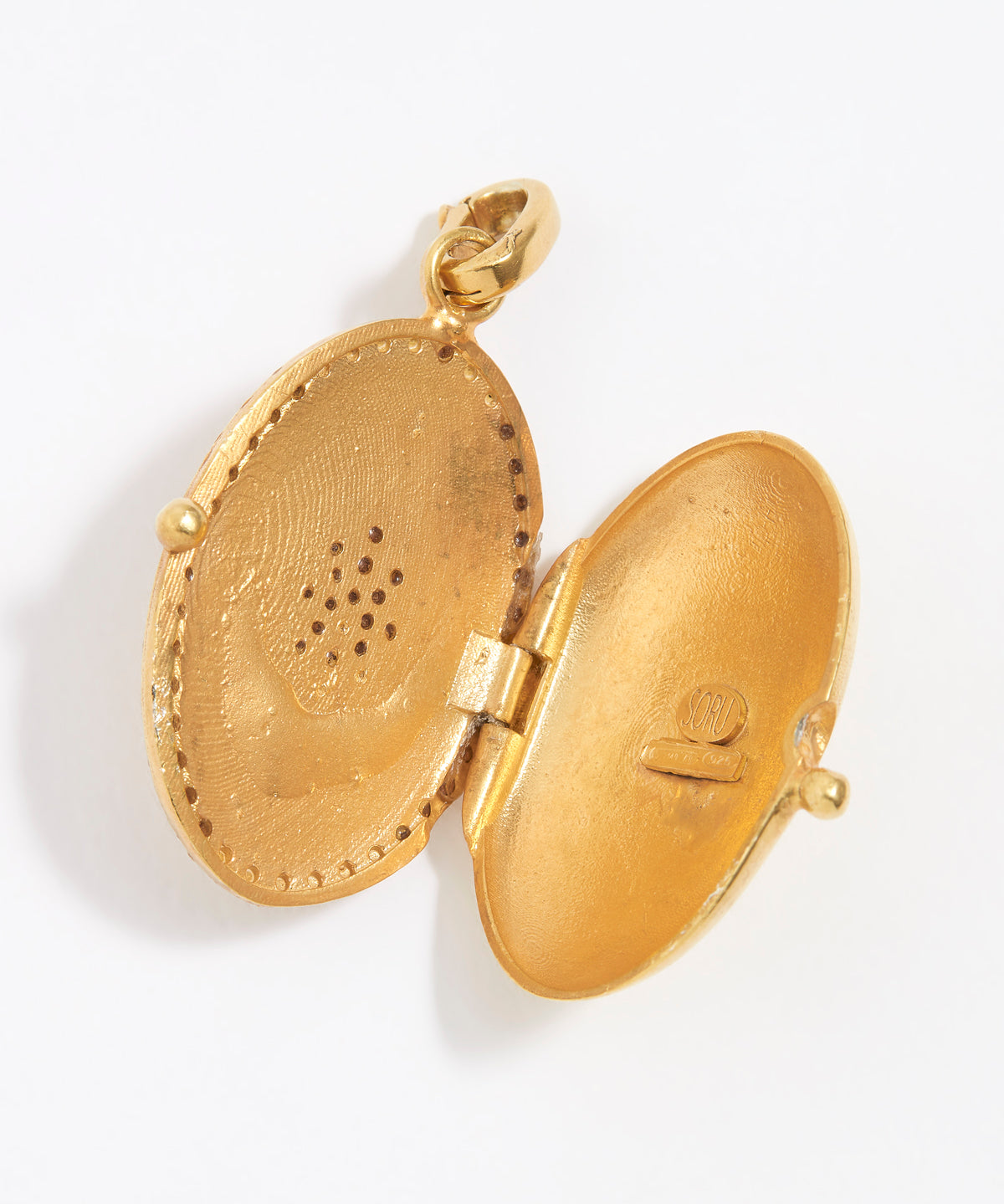 image shows open gilded locket charm 