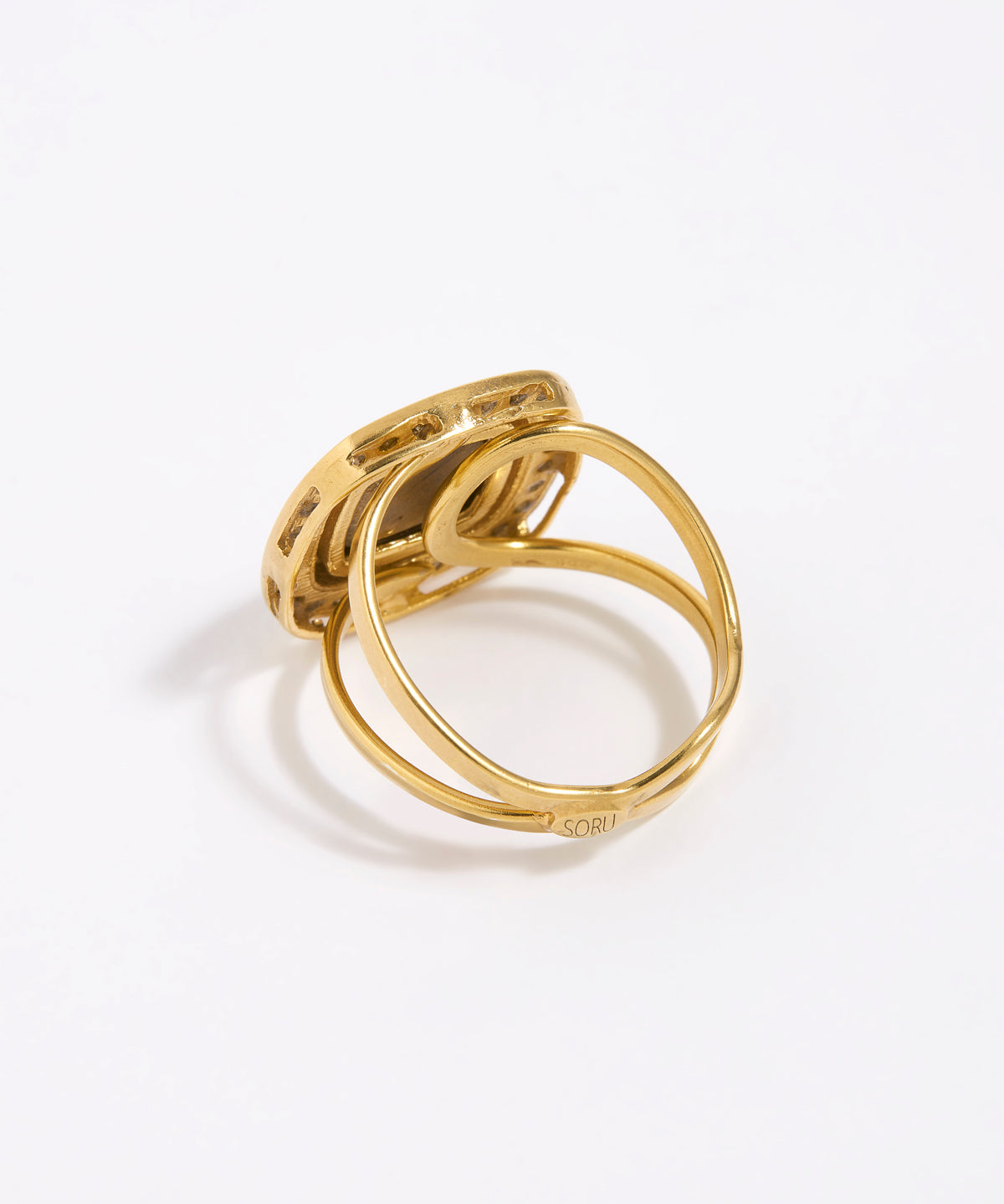 Image shows reverse of greta ring with gold adjustable band 