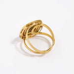 Image shows reverse of greta ring with gold adjustable band 