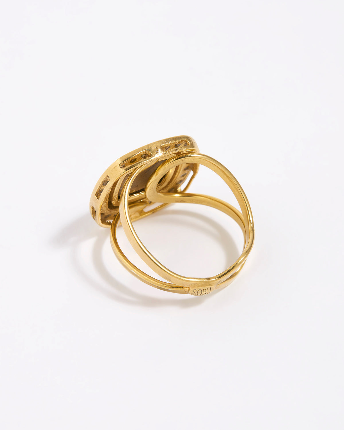 Image shows reverse of greta ring with gold adjustable band 