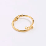 back image of Gold coloured ring with spherical accents on a white background