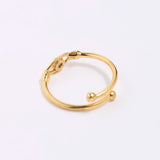 back image of Gold coloured ring with spherical accents on a white background