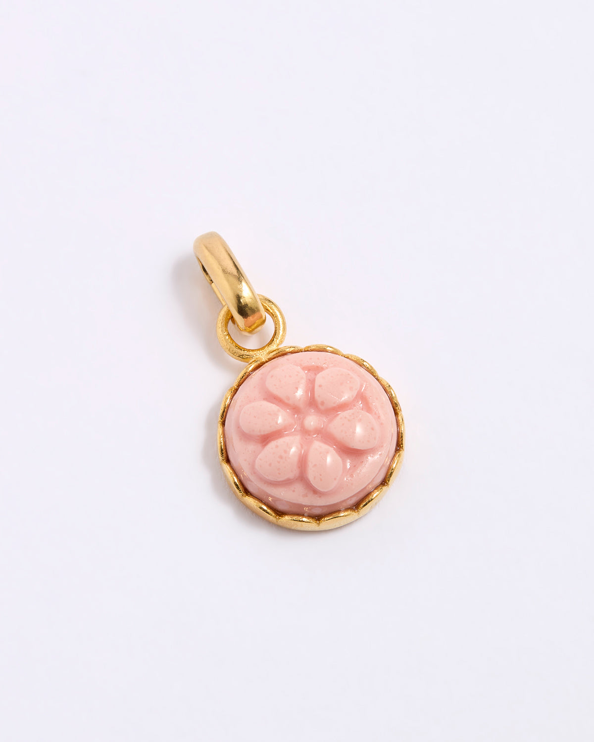 Pink floral pendant with gold frame on a white background