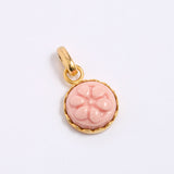 Pink floral pendant with gold frame on a white background