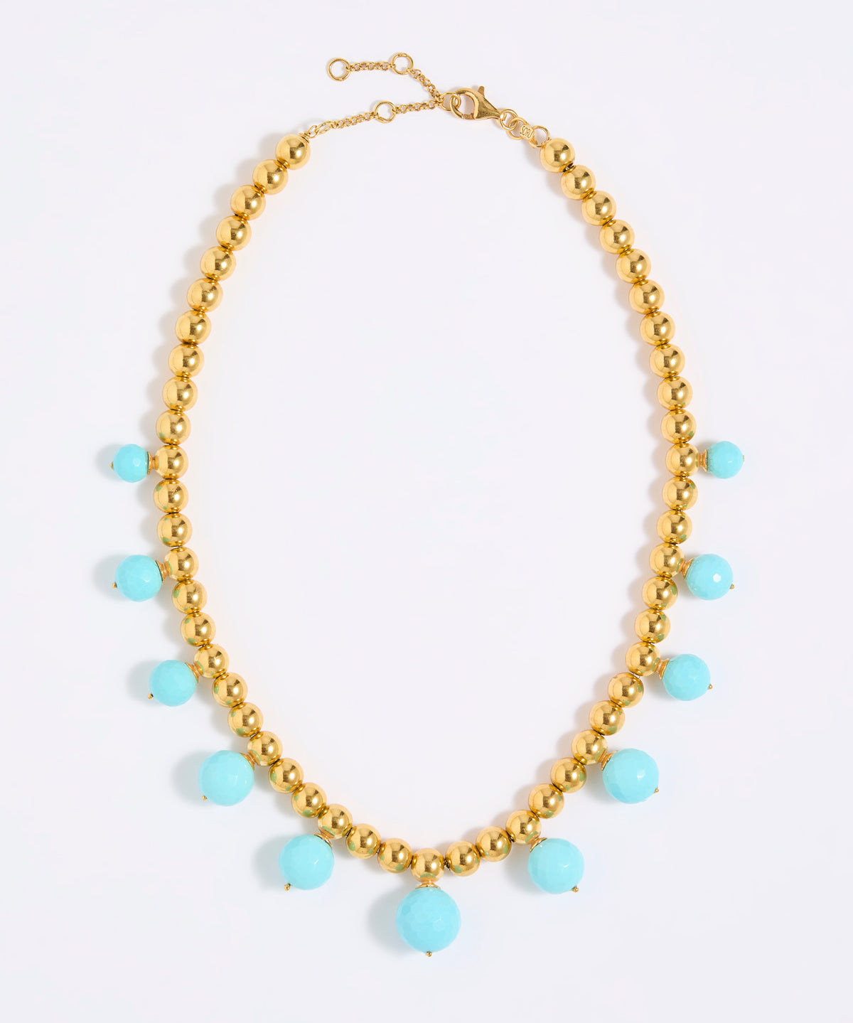 Gold coloured beaded necklace with turquoise beads on a white background
