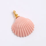 Pink shell pendant with gold coloured clasp on a light gray background