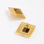 Gold square earrings with intricate designs and tigers eye gemstone, showing reverse of earring on a white background