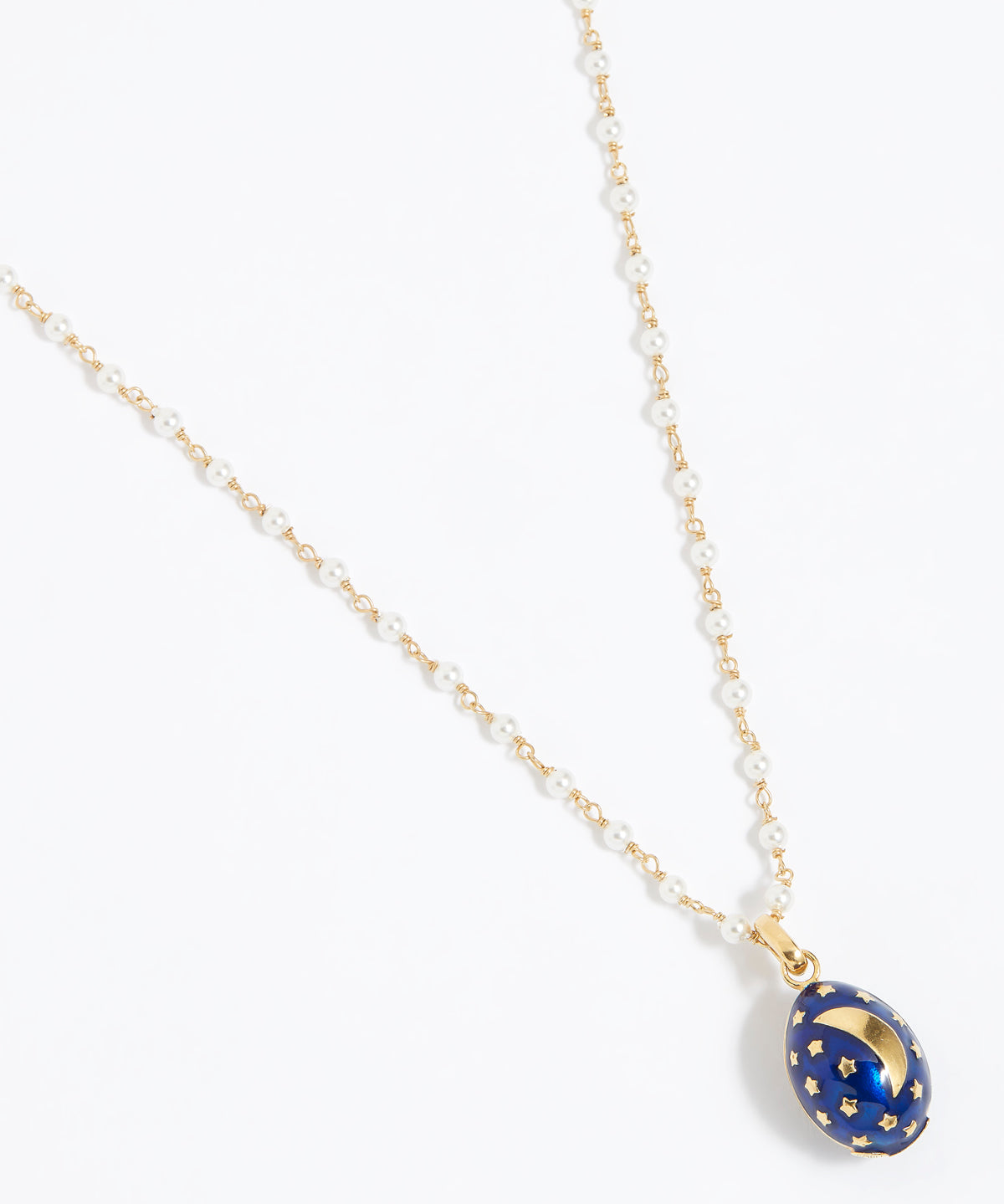 Midnight blue egg shaped charm pendant, with gold star sand crescent moon attached to a pearl charm chain, , on a white background