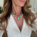 turquoise beaded necklace and earrings worn 