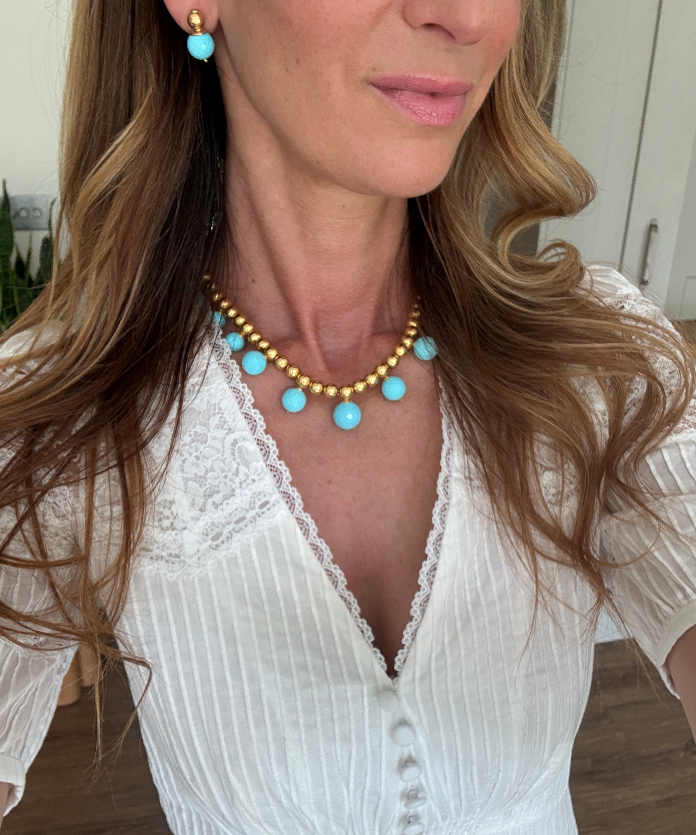 turquoise beaded necklace and earrings worn 