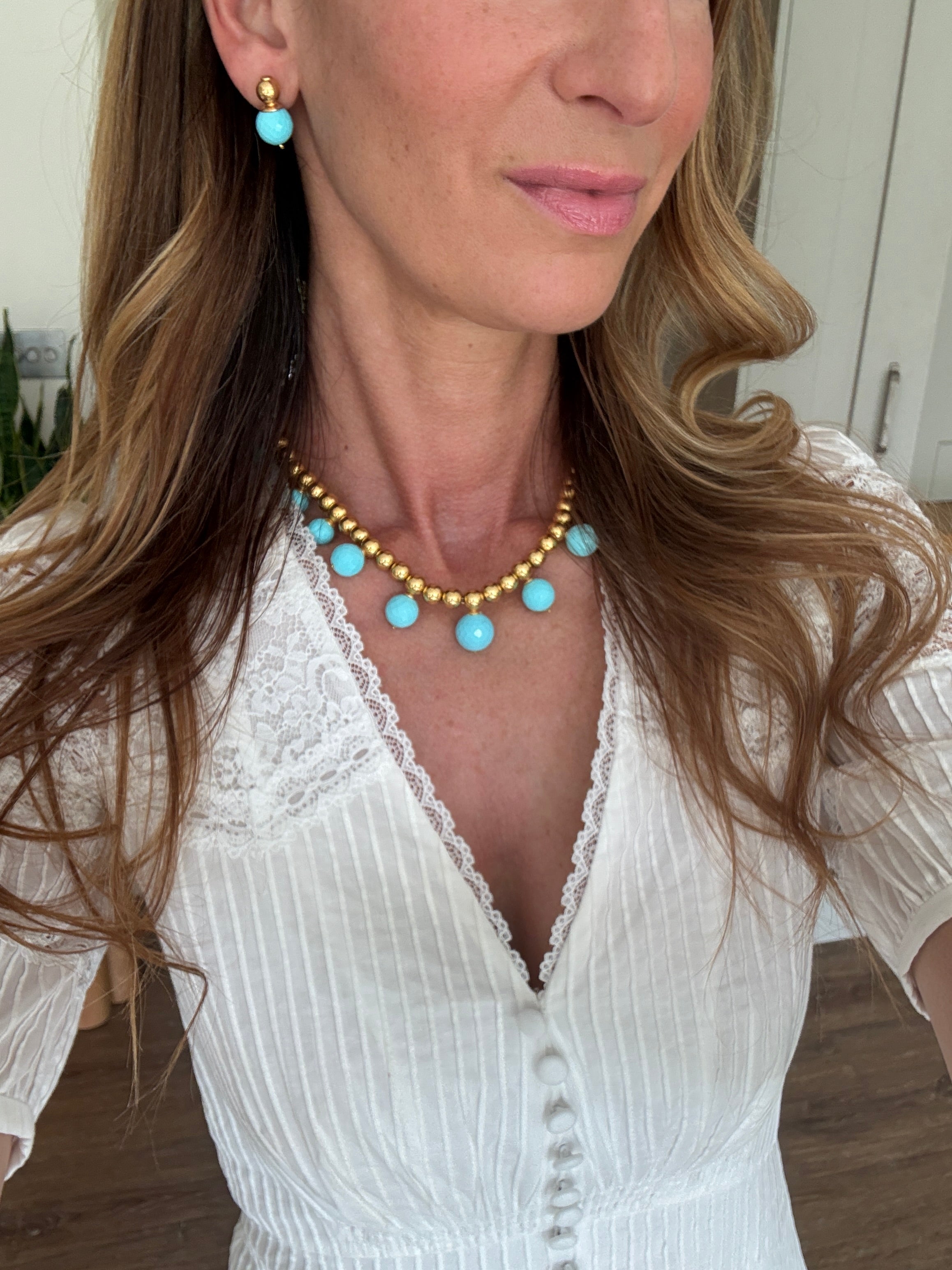 turquoise beaded necklace and earrings worn 