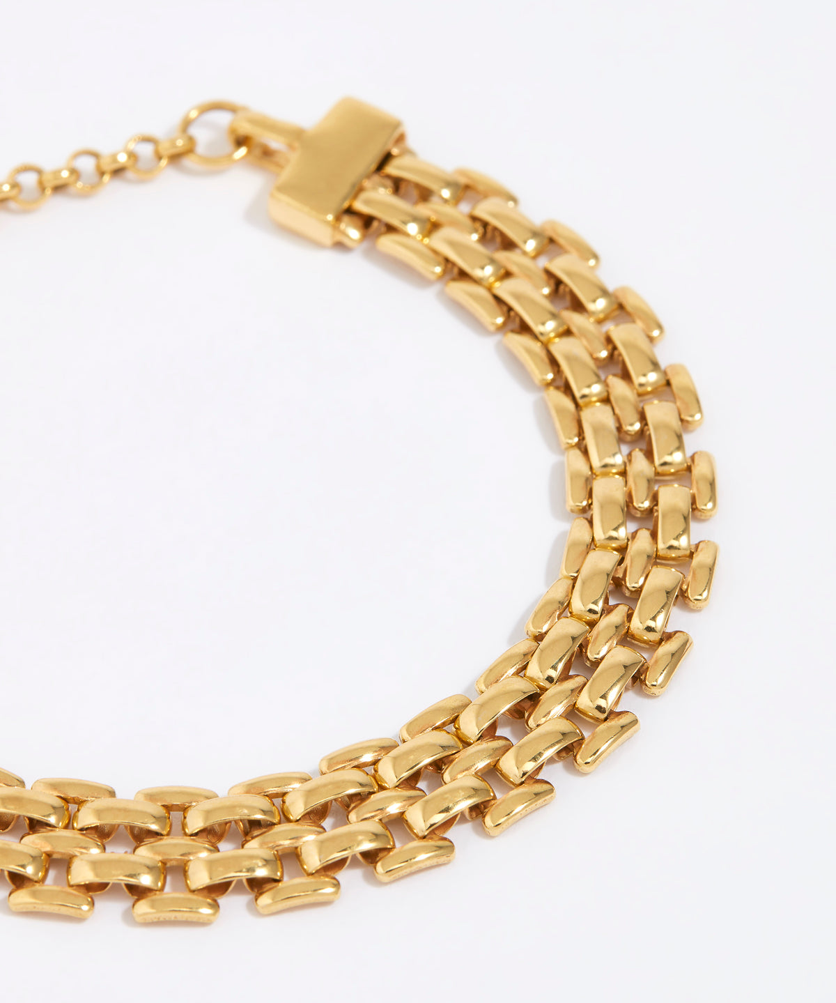 Gold chain bracelet on a white background