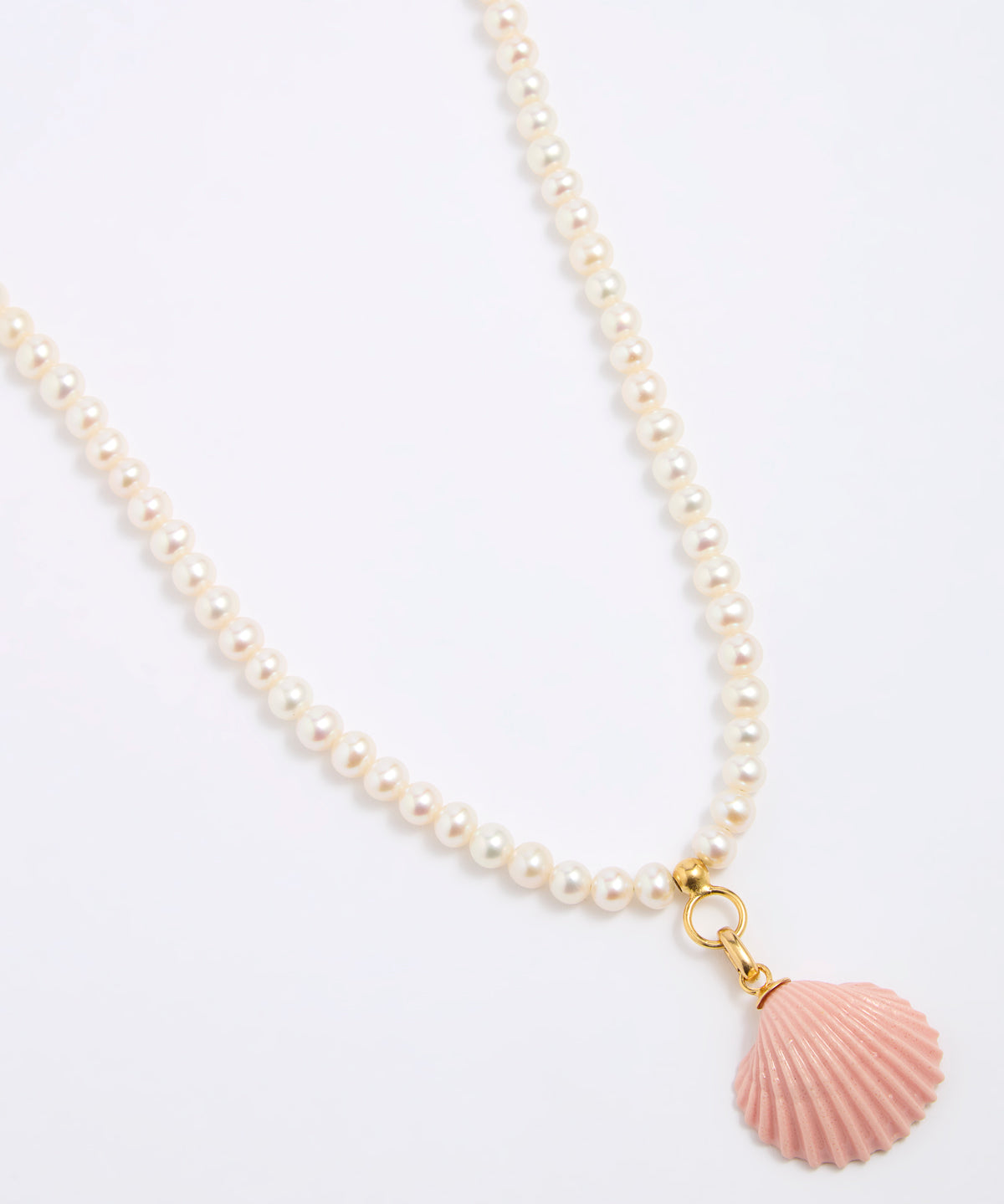 Pearl necklace with a pink shell pendant on a white background