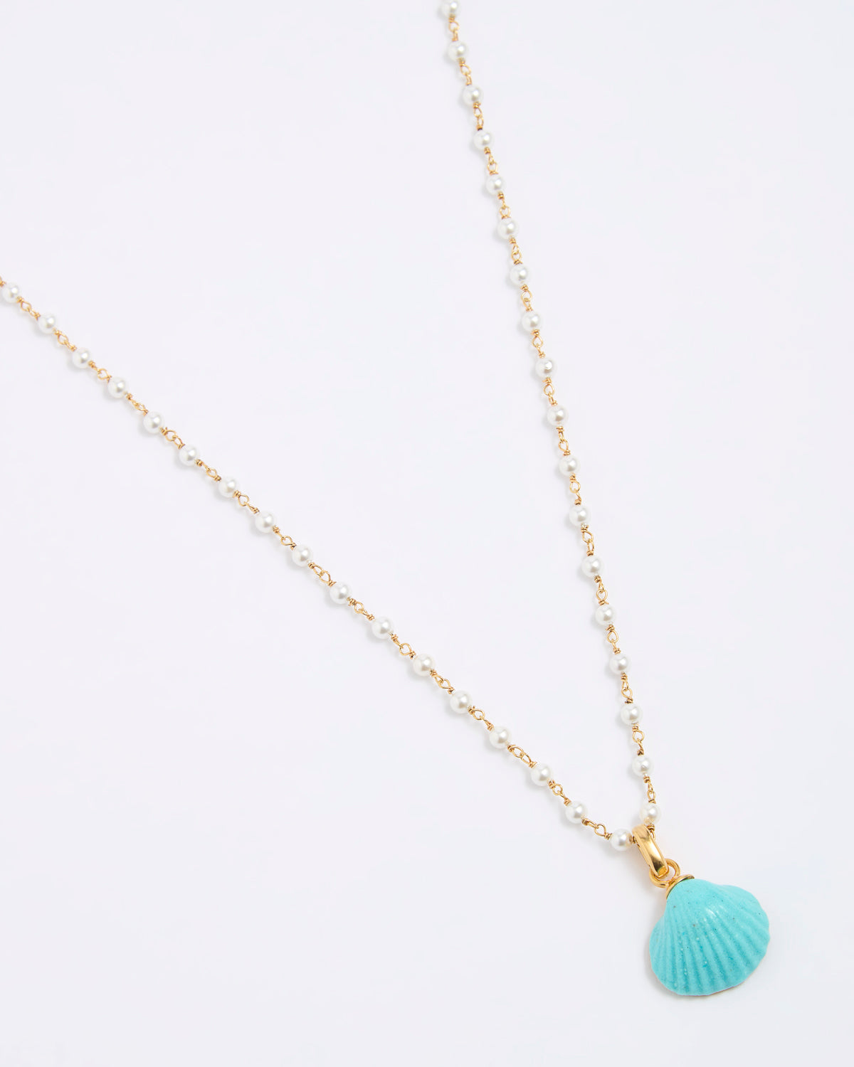 Necklace with a turquoise shell pendant on a white background