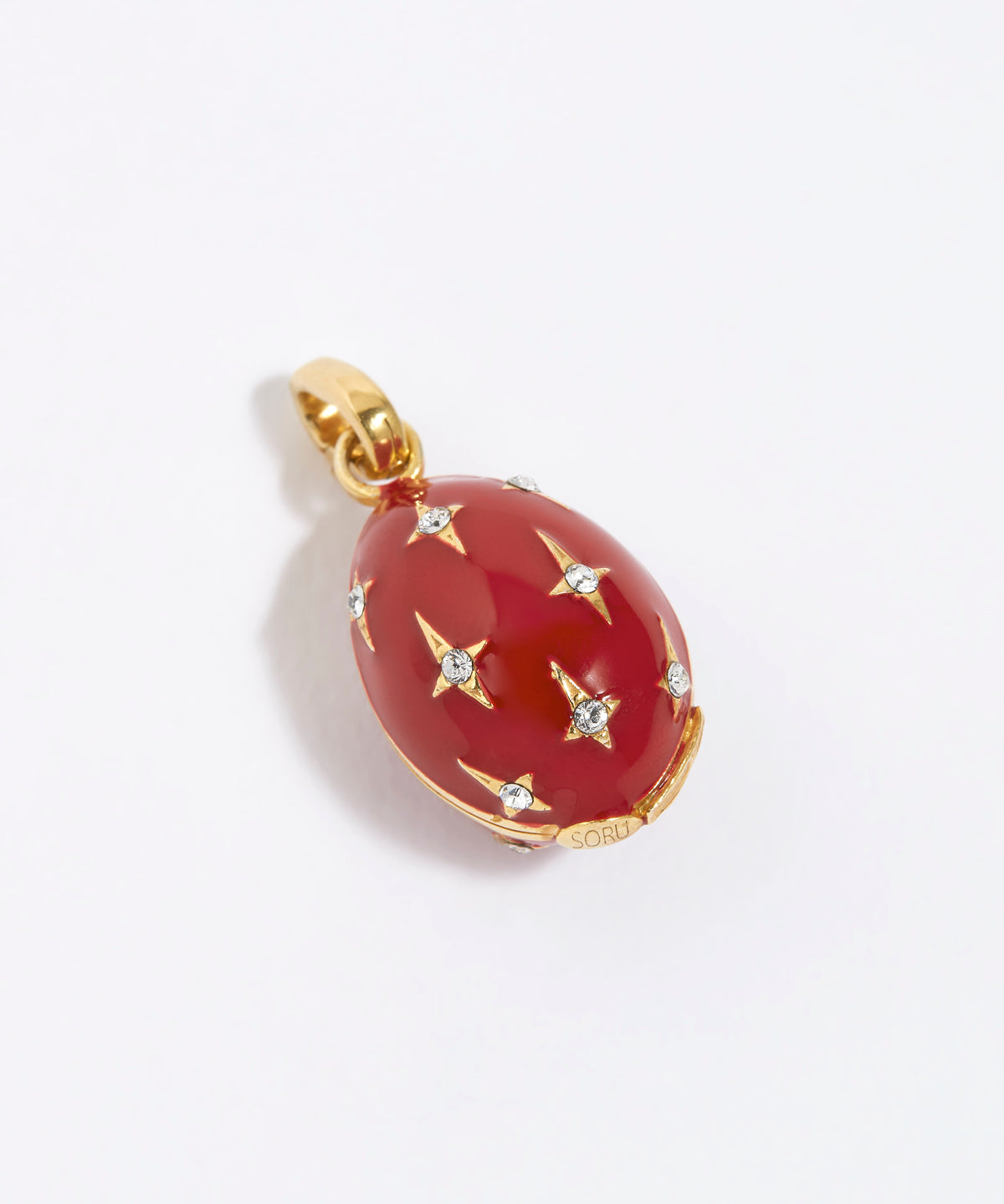 Red egg-shaped pendant with gold accents and star designs on a white background
