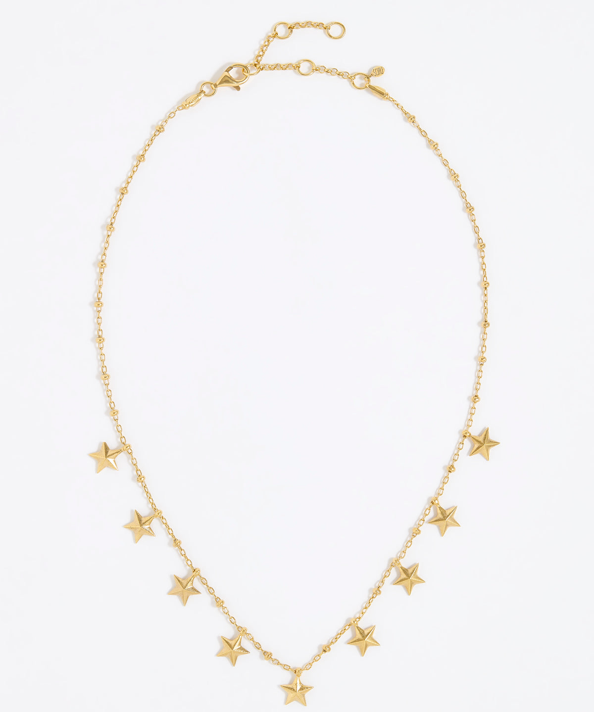 Gold necklace with star-shaped pendants on a white background