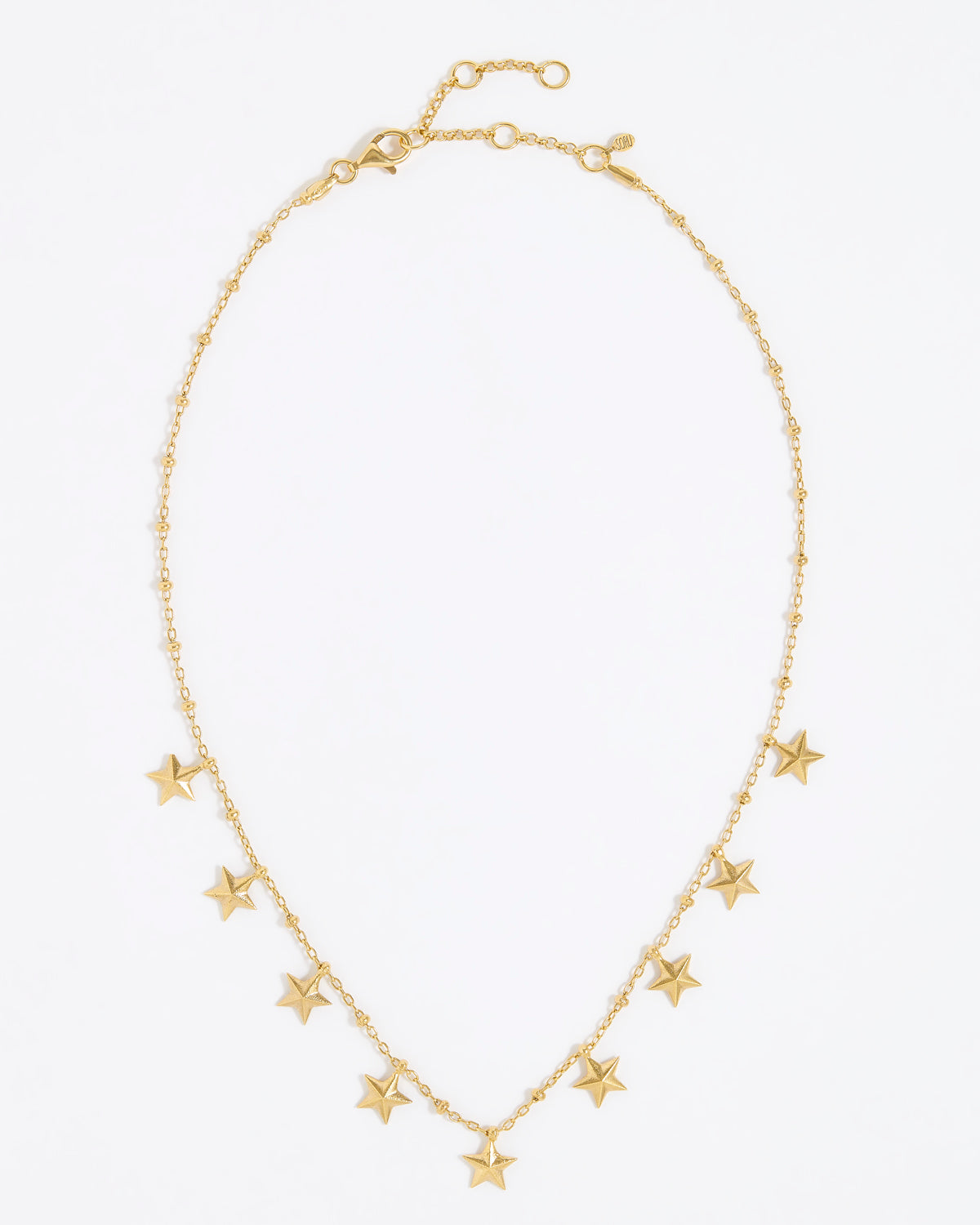 Gold necklace with star-shaped pendants on a white background