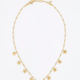 Gold necklace with star-shaped pendants on a white background
