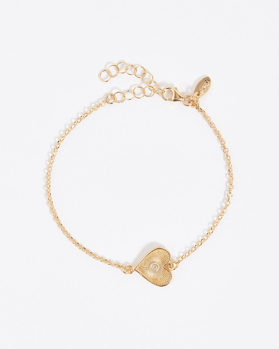 dainty solid gold heart bracelet with diamond centre
