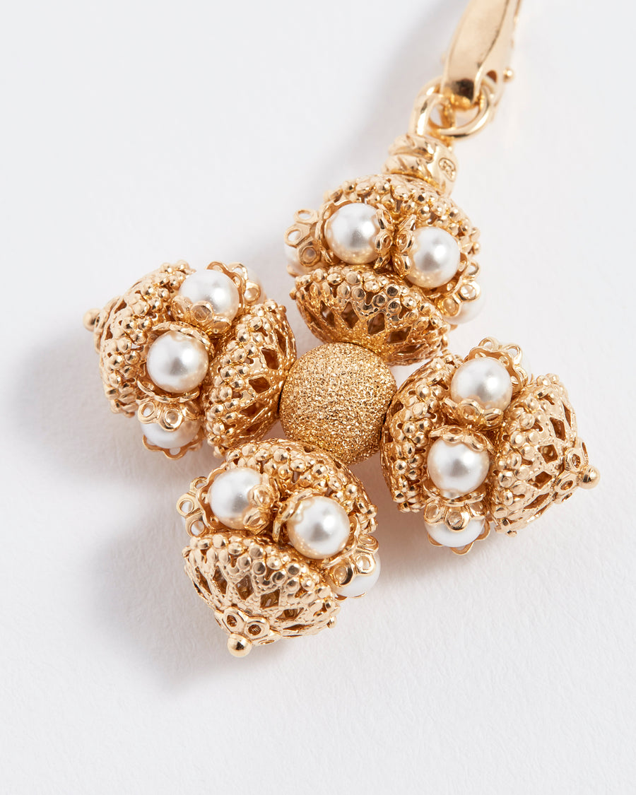 soru jewellery detachable gold and pearl cross charm , close up view 
