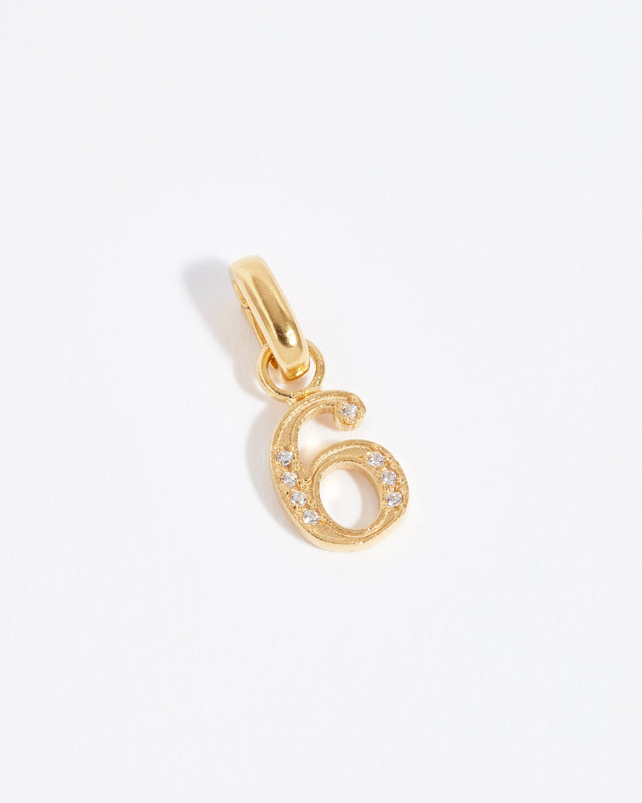 number 6 gold and crystal charm 