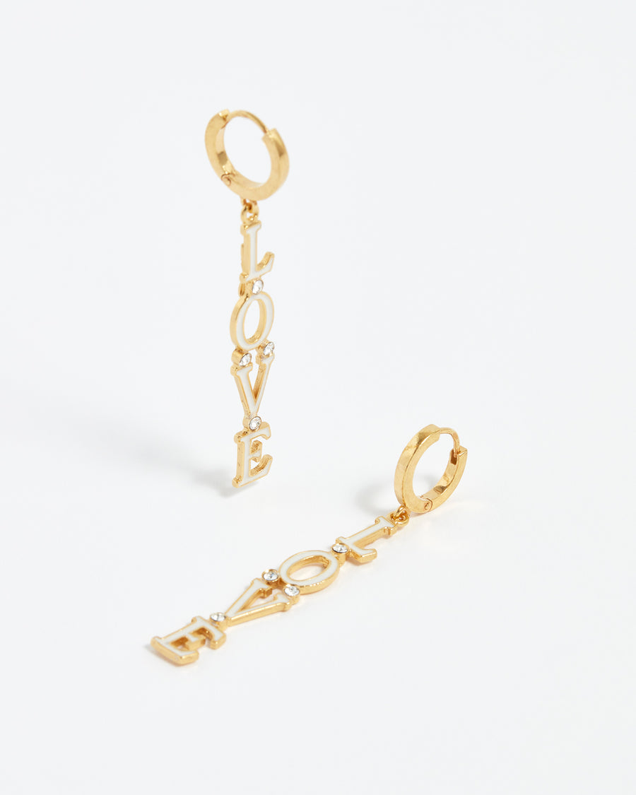 linear style white enamelled love wording earrings on gold plated silver