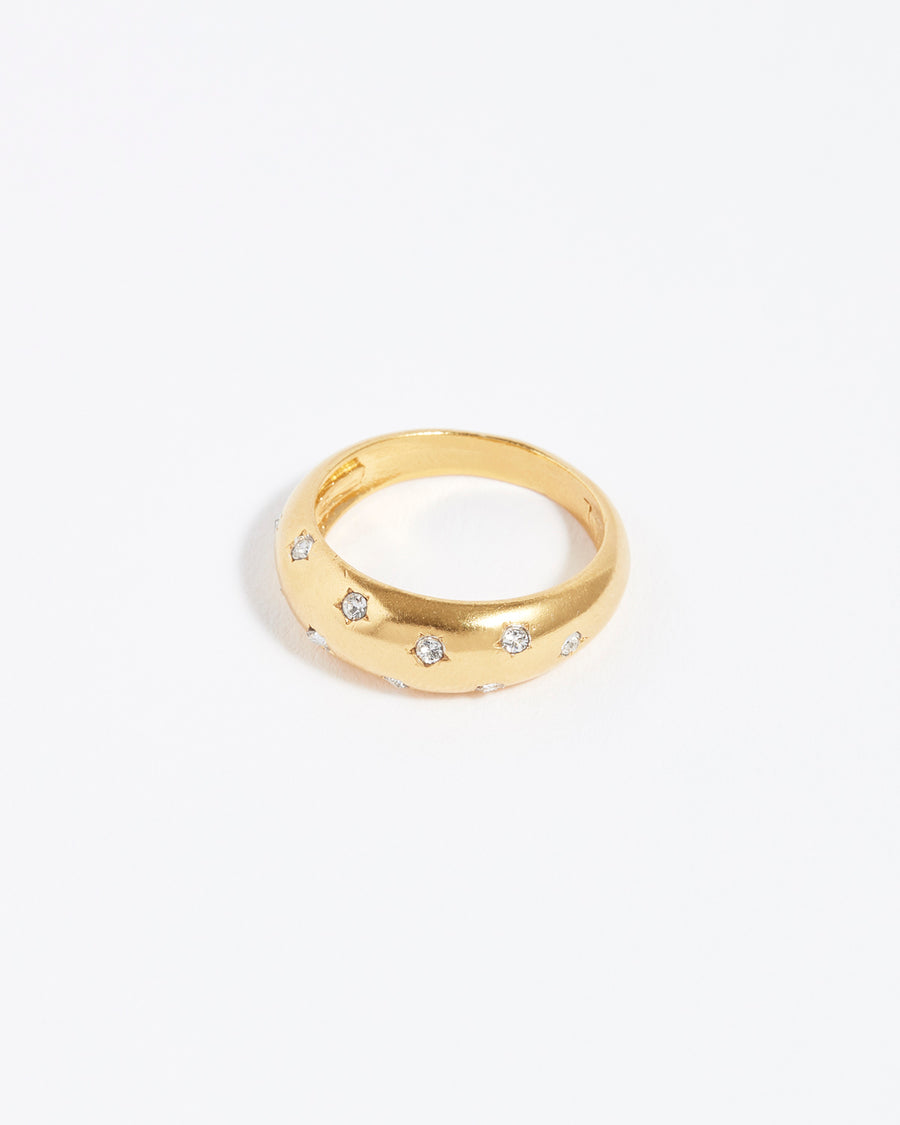 Gold ring studded with clear crystal stars 