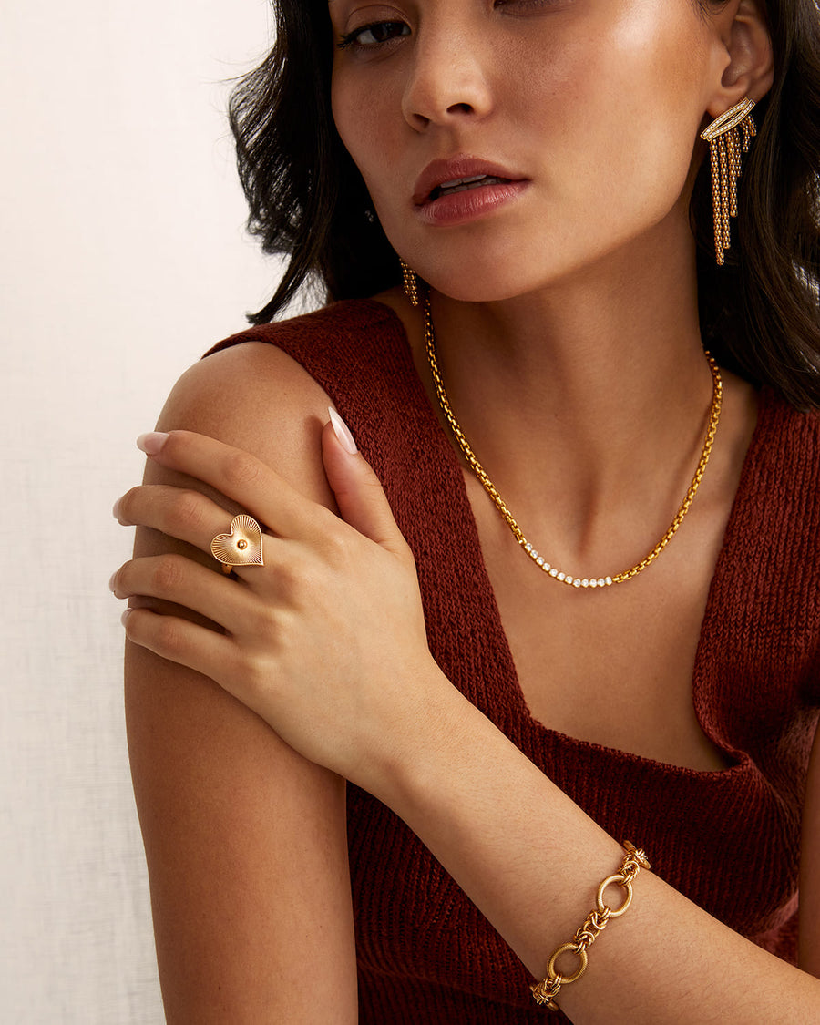 Soru Jewellery model shot showing the gold etched heart ring from further away