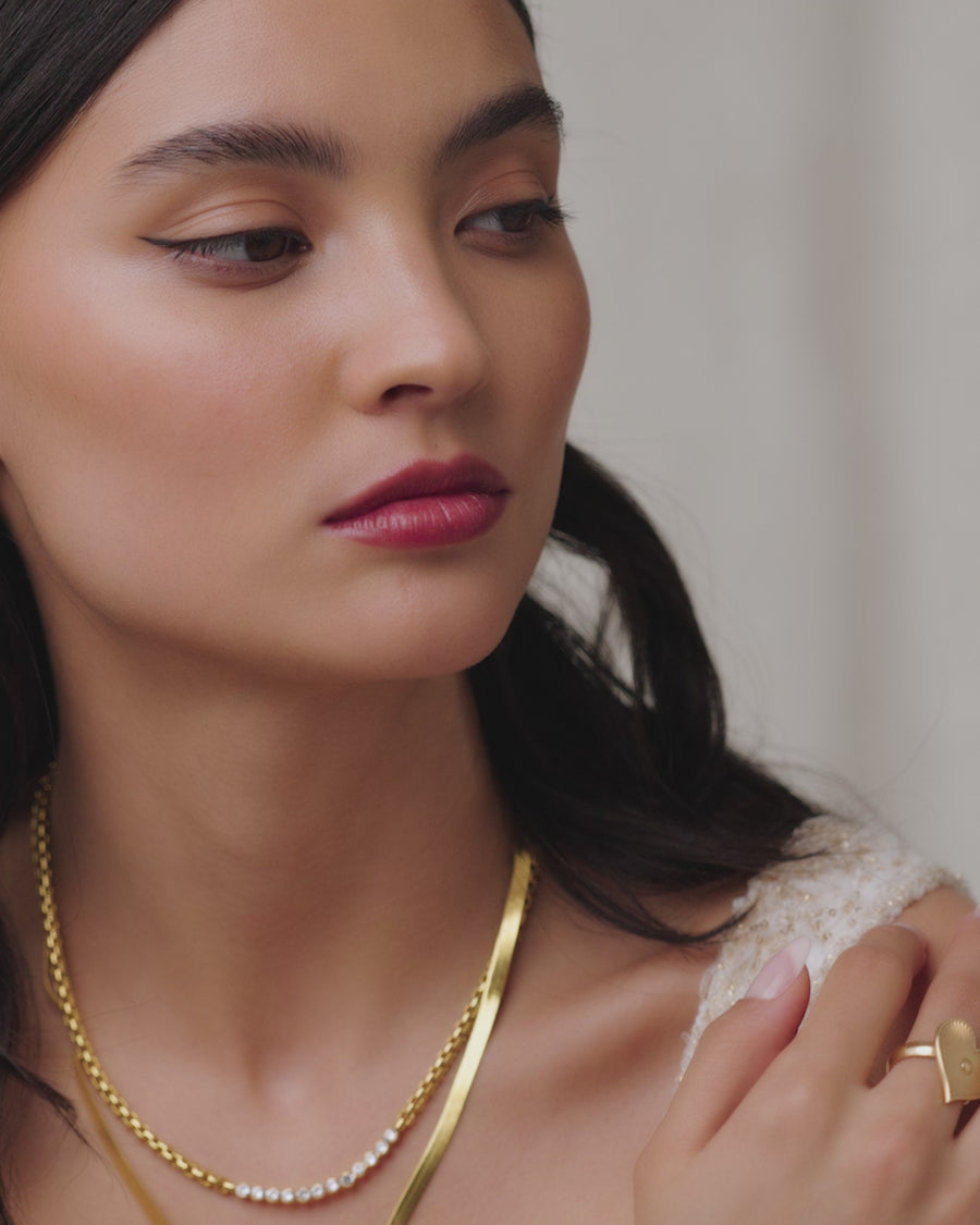 Soru Jewellery video showing model wearing cosmic star small hoop earrings  with clear crystals and gold plated silver