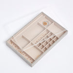 Perspex lid on top of the embroidered linen and velvet Kinship Press X Soru Celestial Jewellery Tray