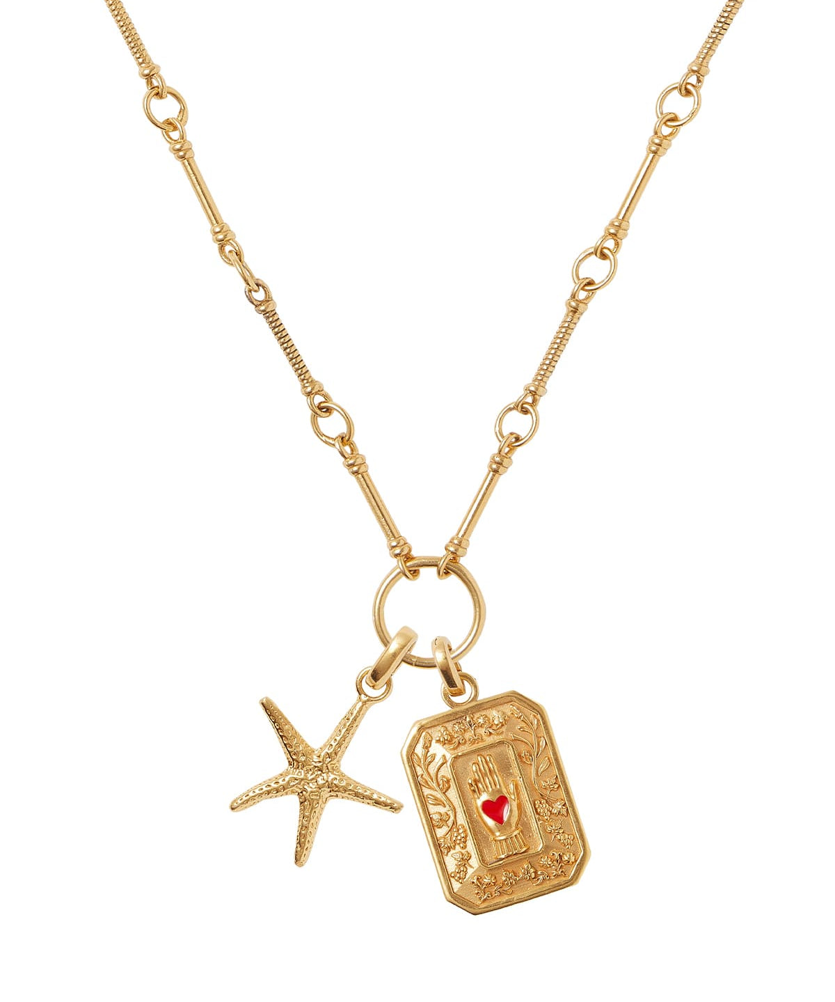 Soru Jewellery gold vintage style charm showing a red enamel heart in hand