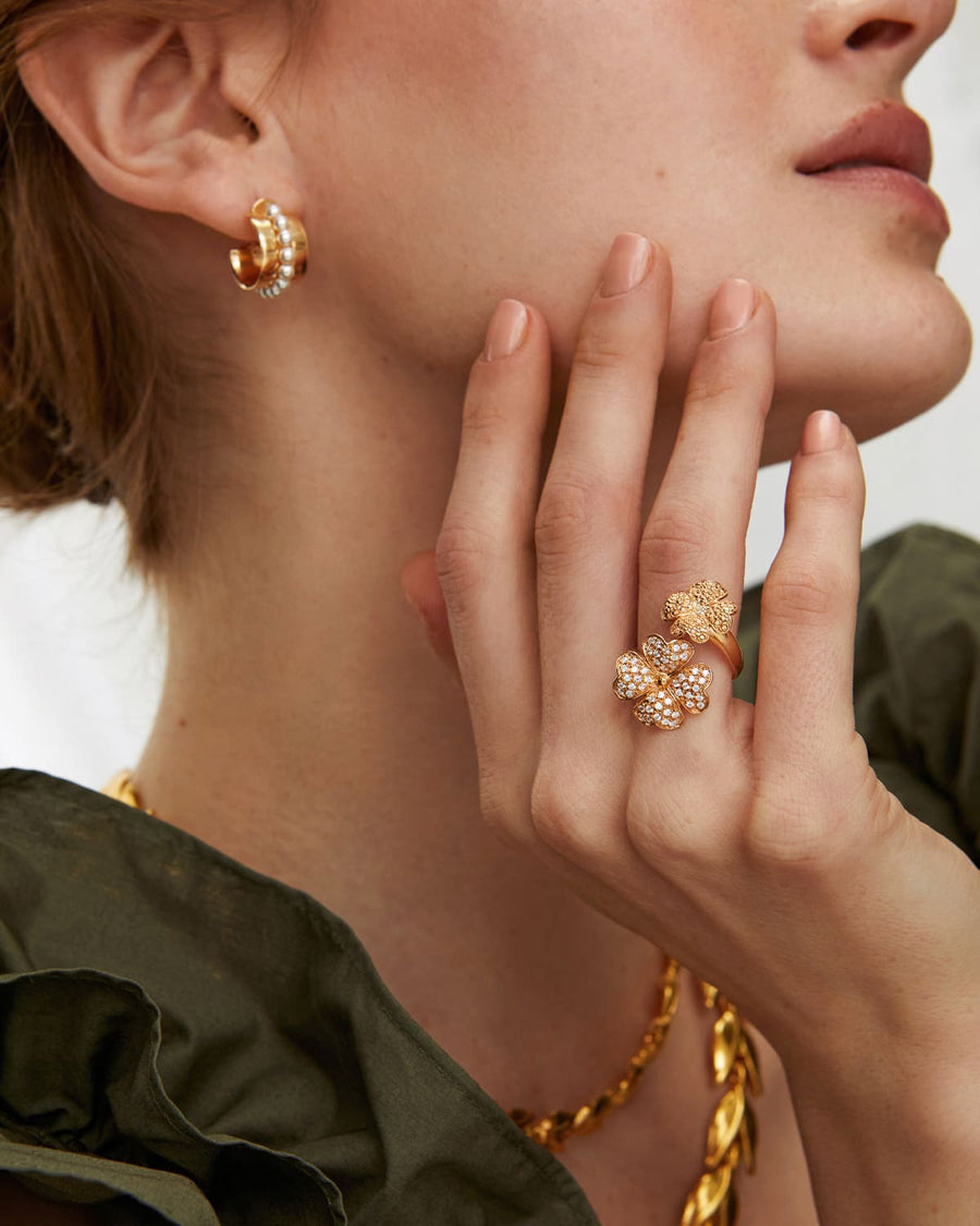 Soru jewellery model shot showing gold hoop earrings with beaded pearl detail